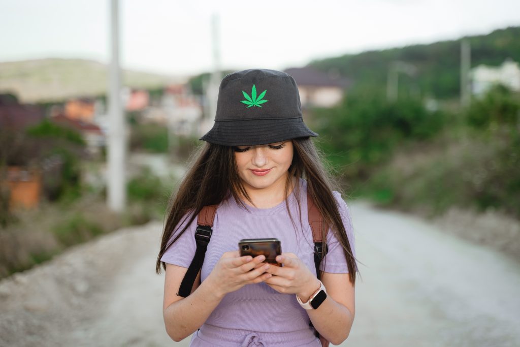 Tourist checking PEI weed delivery menu online.