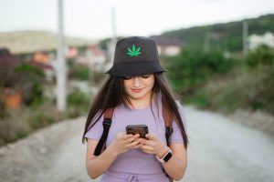 Tourist checking PEI weed delivery menu online.